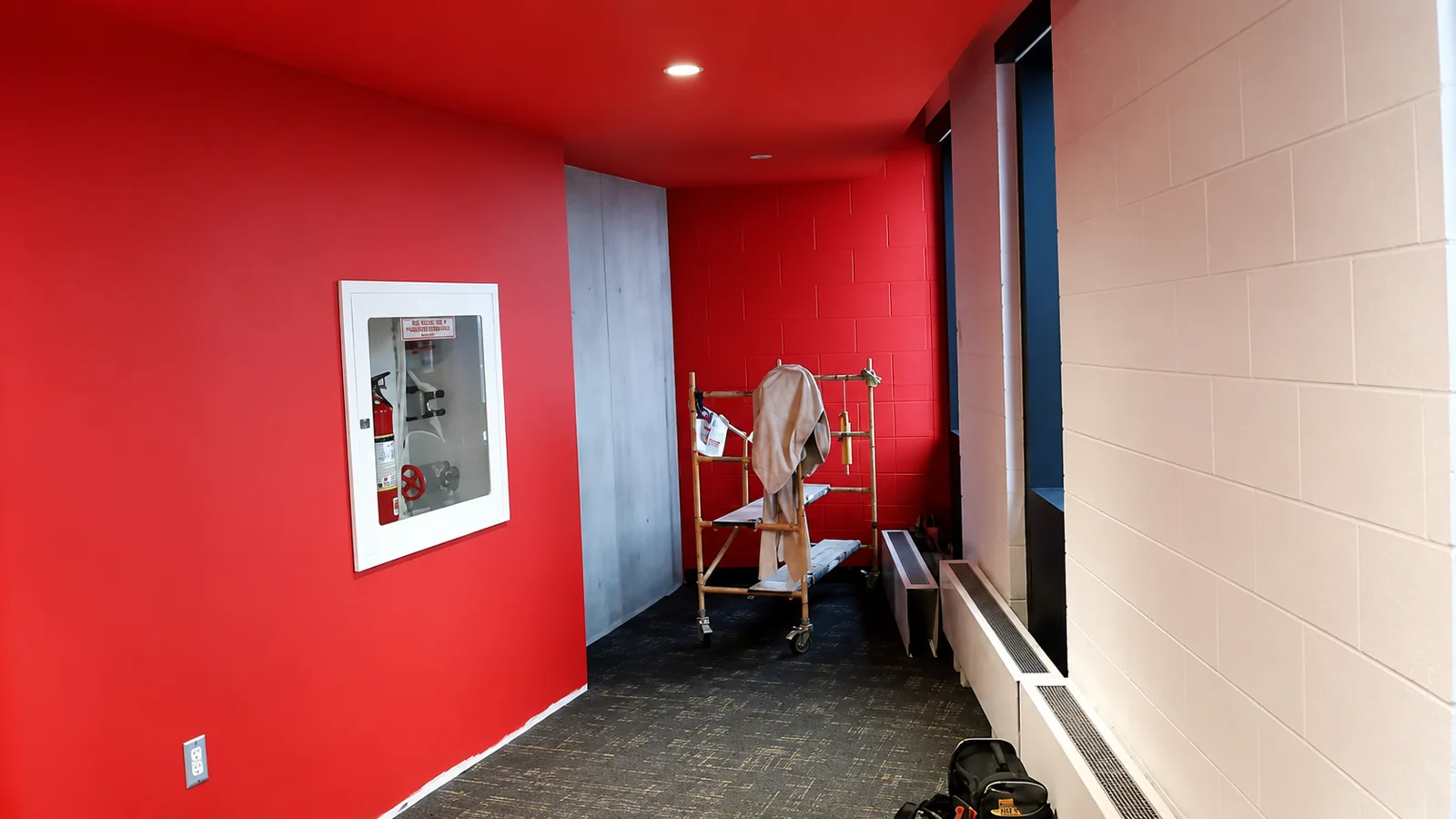 Bold red commercial hallway repaint